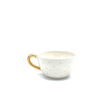 Skodelica zlata s pikicami